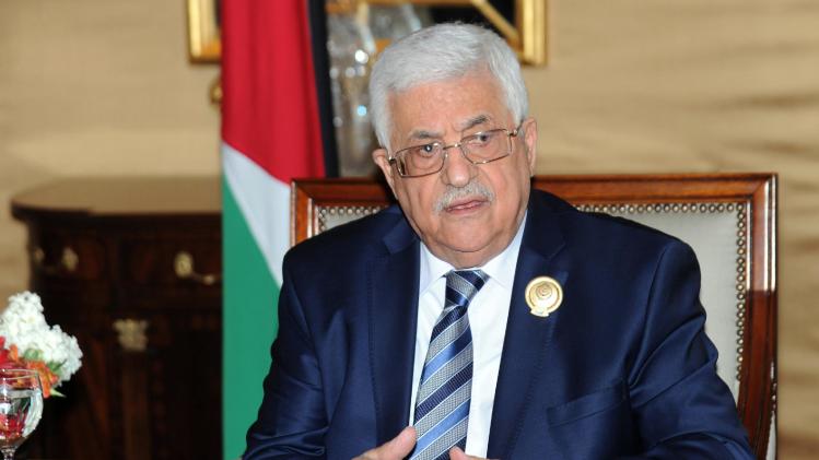 Palestinian President Mahmoud Abbas taks to journalists during a press conference on the sidelines of the Arab League Summit at Bayan Palace, Kuwait on Wednesday, March 26, 2014.(AP Photo/Nasser Waggi)