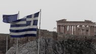 <p>               The flags of Greece, right, and European Union  flutter from the roof of the Finance Minister at Athens' main Syntagma square, as in the background is seen the ancient Parthenon temple during in Athens on Thursday Feb, 9, 2012. Greek Prime Minister Lucas Papademos and his coalition partners have struck a deal on new cuts demanded by creditors to secure a vital euro130 billion bailout. (AP Photo.Dimitri Messinis)