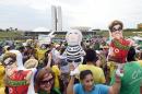 Protesters with inflatable dolls of Brazilian President Dilma Rousseff and former president Lula da Silva demonstrate calling for her impeachment and blaming her for a steep economic downturn in Brazil, in Brasilia on November 15, 2015