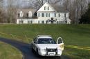 In this Dec. 18, 2012 file photo a police cruiser sits in the driveway of the home of Nancy Lanza, in Newtown, Conn. The Newtown Legislative Council is voting Wednesday, Jan. 21, 2015 on a proposal recommended by the board of selectmen to raze the 3,100-square-foot home and keep the land as open space. The Colonial-style home where Newtown school shooter Adam Lanza lived with his mother has been transferred to the town in a deal with a bank. Nancy Lanza was killed there by her son before he forced his way into Sandy Hook Elementary School, Dec. 14, 2012, in Newtown, where he killed 20 first-graders and six educators. (AP Photo/Jason DeCrow, File)