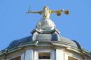 The statue of justice stands on the copula of the Old Bailey courthouse on December 17, 2003 in London