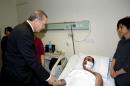Presidential Palace handout photo shows Turkish President Erdogan visiting a victim of Wednesday's car bombing at a hospital in Ankara