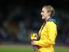 Australia's Pearson stands on the podium after being presented with the gold medal for the women's 100m hurdles at the London 2012 Olympic Games in London
