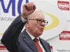 Berkshire Hathaway Chairman Buffett shouts slogan "Never give up, Iwaki" in Japanese at end of his news conference after opening ceremony of Tungaloy Corp's new plant in Iwaki