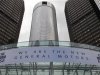A banner hangs on the front of the General Motors Co world headquarters announcing GM's return to NYSE in Detroit