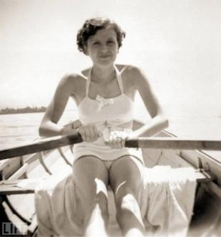 Recently released photographs from Eva Braun's personal picture albums reveal new dimensions of the woman who was Adolf Hitler's longtime girlfriend and, in their last, frantic hours together, his wife. Braun became the central woman in Hitler's life after the 1931 suicide of Geli Raubal, the future Führer's 23-year-old niece (and rumored lover). By all accounts, Eva was an unpretentious companion for the Nazi leader, but also a woman at once frivolous and vain -- unsurprising characteristics, perhaps, in a former teenage model, but striking in a figure long associated with the darkest chapters of the 20th century. This collection of rare and previously unseen photos comes from a cache of images confiscated by the U.S. Army in 1945 and brought to light by collector and curator Reinhard Schulz. Pictured: Eva Braun in a rowboat on Lake Worthsee near Munich in 1937. Galerie Bilderwelt/Getty Images