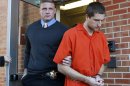 FILE - In this Nov. 13, 2012, file photo, Micah Moore, 23, right, is escorted into the Jackson County Courthouse Annex in Independence, Mo., for his murder charge in the death of 27-year-old Bethany Ann Deaton. Moore is scheduled for a preliminary hearing on a first-degree murder charge Wednesday, Nov. 28, 2012. (AP Photo/The Kansas City Star, Keith Myers, File)
