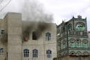 Smoke rises from a building on April 8, 2015, following a reported air strike on a nearby target by the Saudi-led coalition against Huthi Shiite rebels and their allies in the capital Sanaa
