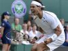 Rafael Nadal of Spain reacts to breaking serve in the fourth set in his men's singles tennis match against Lukas Rosol of the Czech Republic at the Wimbledon tennis championships in London