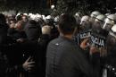 Montenegro's opposition protesters scuffle with police on October 17, 2015 in Podgorica