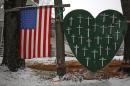 A memorial honoring the victims killed in the Sandy Hook Elementary School shooting is seen outside a home in Sandy Hook, Connecticut