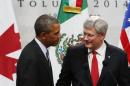 U.S. President Barack Obama joins Canada's Prime Minister Stephen Harper before a trilateral meeting in Mexico