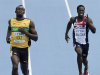 Jamaica's Usain Bolt and Britain's Christian Malcolm, right, compete in a Men's 200m heat at the World Athletics Championships in Daegu, South Korea, Friday, Sept. 2, 2011. (AP Photo/Martin Meissner)