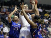 Delaware's Elena Delle Donne (11) is pressured under the basket by Kansas' Tania Jackson (33) and Cece Harper (24) during the first half of an NCAA tournament second-round women's college basketball game in Little Rock, Ark., Tuesday, March 20, 2012. (AP Photo/Danny Johnston)