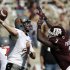 Oklahoma State quarterback Brandon Weeden (3) throws a pass as he is pressured by Texas A&M defensive back Terrence Frederick (7) during the second quarter of an NCAA college football game Saturday, Sept. 24, 2011, in College Station, Texas. (AP Photo/David J. Phillip)