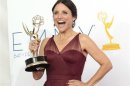 Julia Louis-Dreyfus holds the award for outstanding lead actress in a comedy series for her role in "Veep" at the 64th Primetime Emmy Awards in Los Angeles