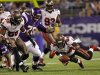 Tampa Bay Buccaneers linebacker Lavonte David tries to recover a Minnesota Vikings fumble