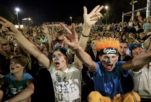 Ukraine soccer fans react while watching a screening of the Group D Euro 2012 against England at a fan zone in Donetsk