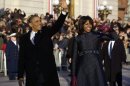 President Barack Obama and first lady Michelle Obama waves as they walk down Pennsylvania Avenue near the White House during the 57th Presidential Inauguration parade Monday, Jan. 21, 2013, in Washington. (AP Photo/Charles Dharapak)