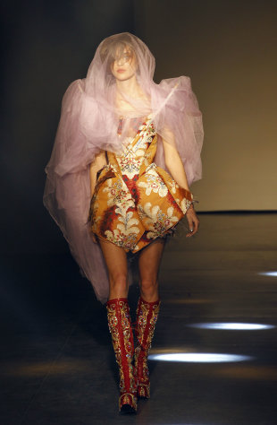 A model wears a creation by designer Vivienne Westwood as part of the Fall-Winter, ready-to-wear 2013 fashion collection, during Paris Fashion week, Saturday, March 3, 2012. (AP Photo/Christophe Ena)