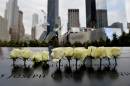 White roses at the World Trade Center North Pool during memorial observances on the 13th anniversary of the 9/11 terror attacks in New York, on September 11, 2014