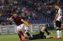 Roma's Vasileios Torosidis, right, celebrates past Udinese's goalkeeper Orestis Karnezis, center, and Widmer Silvan after scoring during a Serie A soccer match between Roma and Udinese, at Rome's Olympic stadium, Sunday, May 17, 2015. (AP Photo/Riccardo De Luca)