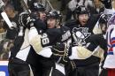 Pittsburgh Penguins' Jussi Jokinen (36) celebrates his goal with teammates Evgeni Malkin, left, and James Neal during the second period of Game 7 of a second-round NHL playoff hockey series against the New York Rangers, in Pittsburgh on Tuesday, May 13, 2014. (AP Photo)