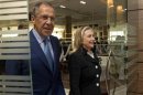 U.S. Secretary of State Clinton and Russian Foreign Minister Lavrov leave a meeting in St. Petersburg