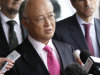 Director General of the International Atomic Energy Agency, IAEA, Yukiya Amano from Japan speaks to the media after returning from Iran at the Vienna International Airport near Schwechat, Austria, on Tuesday, May 22, 2012. Amano says he has reached a deal with Iran on probing suspected work on nuclear weapons and adds that the agreement will "be signed quite soon." (AP Photo/Ronald Zak)
