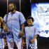 American League's Prince Fielder, of the Detroit Tigers, poses with his children Jaden, left, and Haven after receiving the MLB All-Star baseball Home Run Derby trophy, Monday, July 9, 2012, in Kansas City, Mo. (AP Photo/Charlie Riedel)