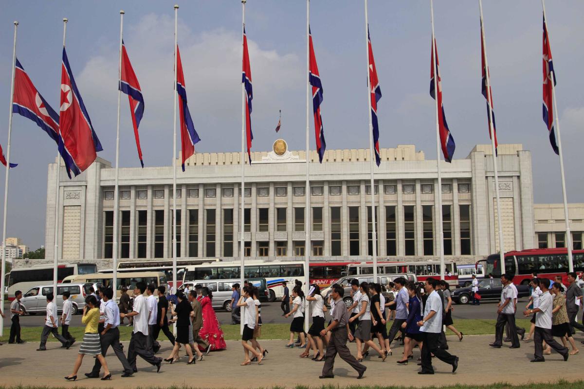 North Korea&#39;s national flags are hoisted at half mast during the 20th anniversary of the dead of the late leader Kim Il Sung in Pyongyang, North Korea, Tuesday, July 8, 2014. (AP Photo/Jon Chol Jin)