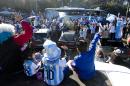 Fans of Argentina's national soccer team wave to the bus taking the players to the airport in Buenos Aires, Argentina, Monday, June 9, 2014. Argentina's team is leaving Monday to compete in the Brazil's 2014 soccer Word Cup. (AP Photo/Natacha Pisarenko)