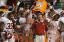 FILE - In this Jan. 7, 2013, file photo, Alabama head coach Nick Saban is doused with Gatorade in the final seconds of the BCS National Championship college football game against Notre Dame in Miami. Alabama will begin this season the way it ended the last two — No. 1. Nick Saban and the two-time defending national champion Crimson Tide are top-ranked in The Associated Press preseason college football poll released Saturday, Aug. 17, 2013, as they try to become the first team to win three straight national titles. (AP Photo/Wilfredo Lee, File)