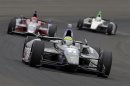 Tony Kanaan, of Brazil, drives through the first turn during the Indianapolis 500 auto race at the Indianapolis Motor Speedway in Indianapolis Sunday, May 26, 2013. (AP Photo/Tom Strattman)