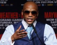 Unbeaten US boxer Floyd Mayweather, seen here, will fight Filipino star Manny Pacquiao after all, although it will be a legal dispute after a federal judge denied a motion to dismiss the case