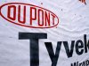 The Dupont logo is displayed on sheets of Tyvek insulation covering the outside wall of a home being built Monday, Jan. 23, 2012 in Springfield, Ill. The DuPont Co.'s fourth-quarter earnings dipped slightly on higher costs but topped Wall Street expectations.(AP Photo/Seth Perlman)