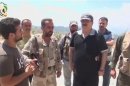 Handout taken from social media website shows General Salim Idriss, head of the rebel Free Syrian Army, speaking during a visit to the coastal province of Latakia