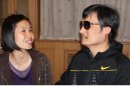In this photo taken in late April, 2012, and released by Hu Jia, blind Chinese legal activist Chen Guangcheng, right, meets with Zeng Jinyan, the wife of human rights activist Hu Jia, at an undisclosed location in Beijing. Chen, an inspirational figure in China's rights movement, slipped away from his well-guarded rural village on April 22, 2012, and made it to a secret location in Beijing on Friday, April 27. Activists say Chen is under the protection of U.S. diplomats in Beijing. (AP Photo/Hu Jia)