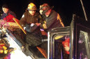 In this photo released by the Boston Fire Department via Twitter, firemen work to remove injured passengers from a bus that hit an bridge as it traveled along Soldiers Field Road in the Allston neighborhood of Boston Saturday night, Feb. 2, 2013. Officials said the bus carryinyg 42 people was traveling from Harvard University home to Pennsylvania when it struck the overpass. (AP Photo/Boston Fire Department)