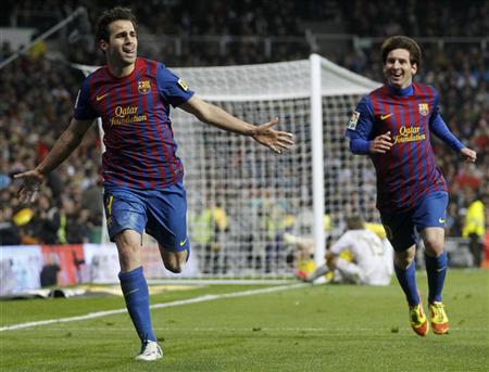 Barcelona's Fabregas celebrates his goal against Real Madrid with teammate Messi during their Spanish first division soccer match, the quot;Clasicoquot;, in Madrid