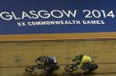 New Zealand's Sam Webster, left, leads Malaysia's Mohd Azizulhasni Awang, right, during the Men's sprint Quarter final at the Velodrome in Glasgow, Scotland, Friday, July 25, 2014. (AP Photo/Scott Heppell)