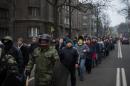 Anti-government protesters march in the streets of the Ukrainian capital Kiev on February 15, 2014