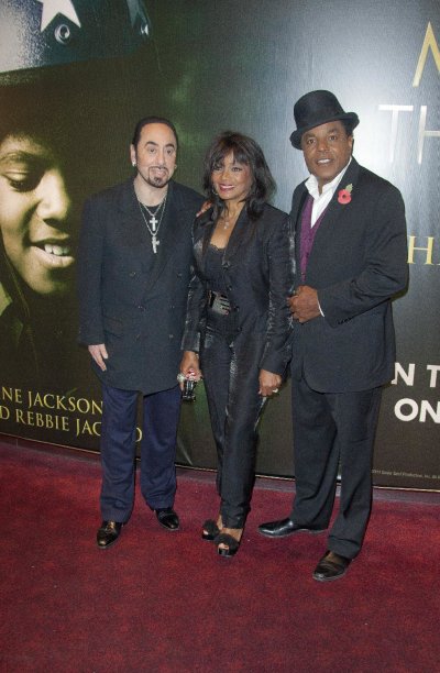 Producer David Gest, left, Rebbie and Tito Jackson, right, arrive for the European Premiere of Michael Jackson: The Life Of An Icon, at a central London cinema, Wednesday, Nov. 2, 2011. (AP Photo/Joel Ryan)