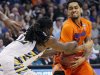 Marquette's Jae Crowder, left, and Florida's Mike Rosario tussle for the ball during the first half of an NCAA men's college basketball tournament West Regional semifinal on Thursday, March 22, 2012, in Phoenix. (AP Photo/Matt York)