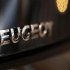 The word Peugeot is displayed on an automobile on display at a dealership in Bordeaux