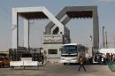 A bus drives through the Rafah border terminal in the southern Gaza Strip on August 24, 2013