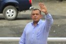 Hondura's President Porfirio Lobo waves during his arrival to the Central American Integration System (SICA) summit in Managua.