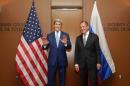 US Secretary of State John Kerry gestures towards reporters as he meets with Russian Foreign Minster Sergey Lavrov at the United Nations on September 30, 2015 in New York