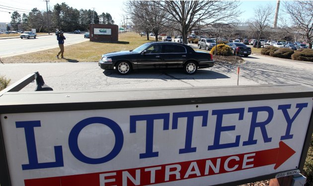 Louise White, 81 from Newport, R.I., leaves the Rhode Island Lottery headquarters in a limousine after being presented a check for $336.4 million in Cranston, R.I., Tuesday, March 6, 2012. White won l