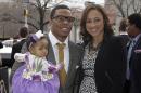 FILE - In this March 11, 2013 file photo, Baltimore Ravens running back Ray Rice, left, poses with his daughter, Rayven, and Janay Palmer as they arrive for a screening of a new film released on DVD that chronicles the team's championship NFL football season in Baltimore. A police complaint alleges Rice knocked out Palmer, his fiancee, during an argument at an Atlantic City, N.J., casino. Police charged both Rice and J Palmer with simple assault in the incident Saturday, Feb. 16, at the Revel Casino. (AP Photo/Patrick Semansky, File)